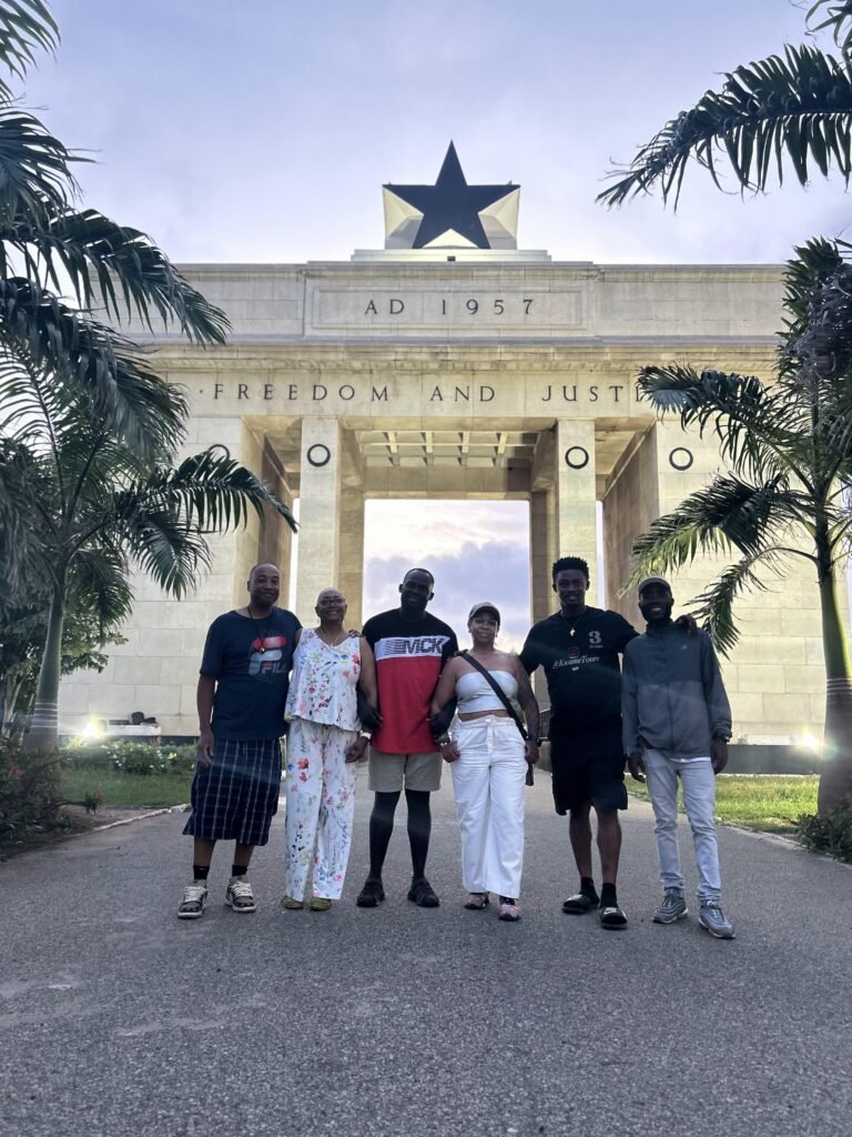 Travelers exploring the iconic Black Star Square during a to do in Accra Ghana tour