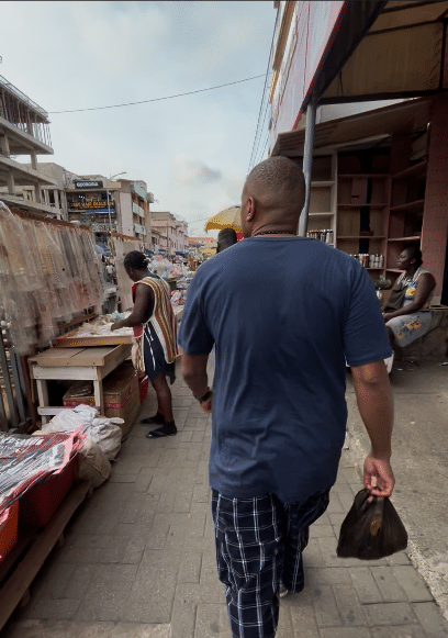 A traveler enjoying a Ghana solo adventure in a local market