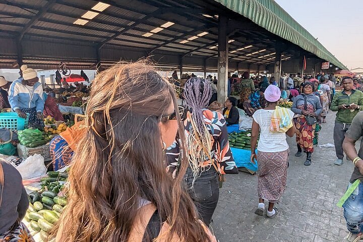 Travelers enjoying free local events in a bustling Lusaka community space