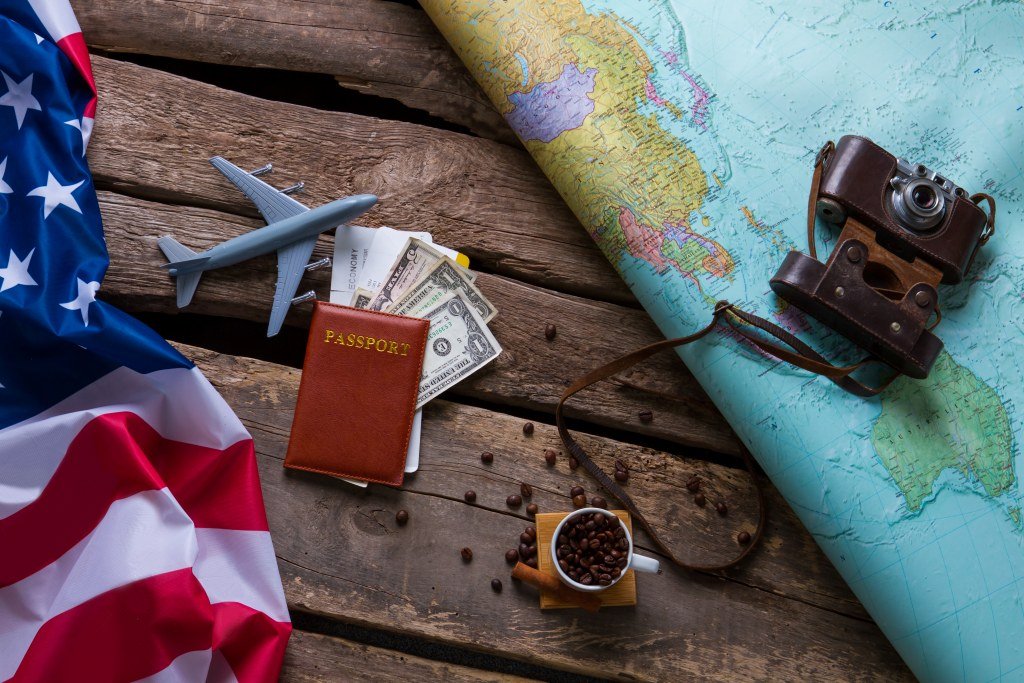 Work and travel - brown passport and us flag